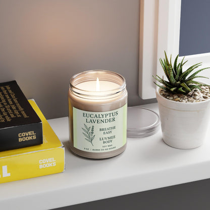 Eucalyptus lavender candle in a jar on a shelf with books and a small plant
